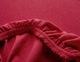Spannbettlaken aus Bio Jersey überzogen auf Matratze in Rot
